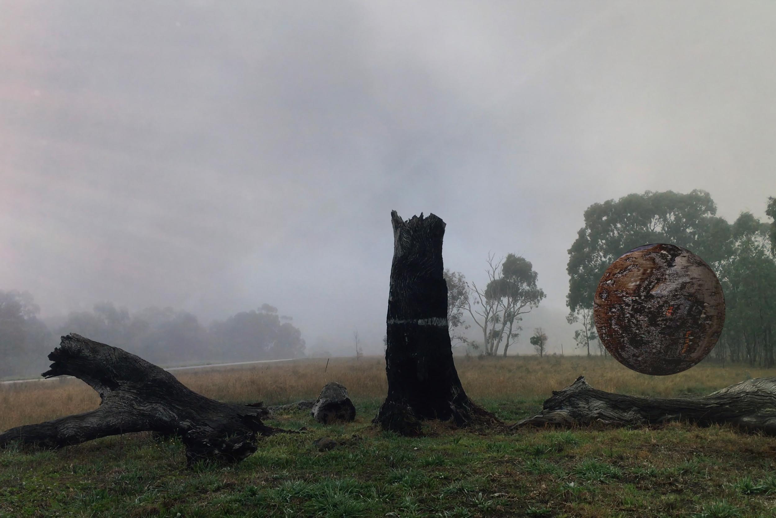 Still from Collider showing a spherical landscape object suspended in a misty field