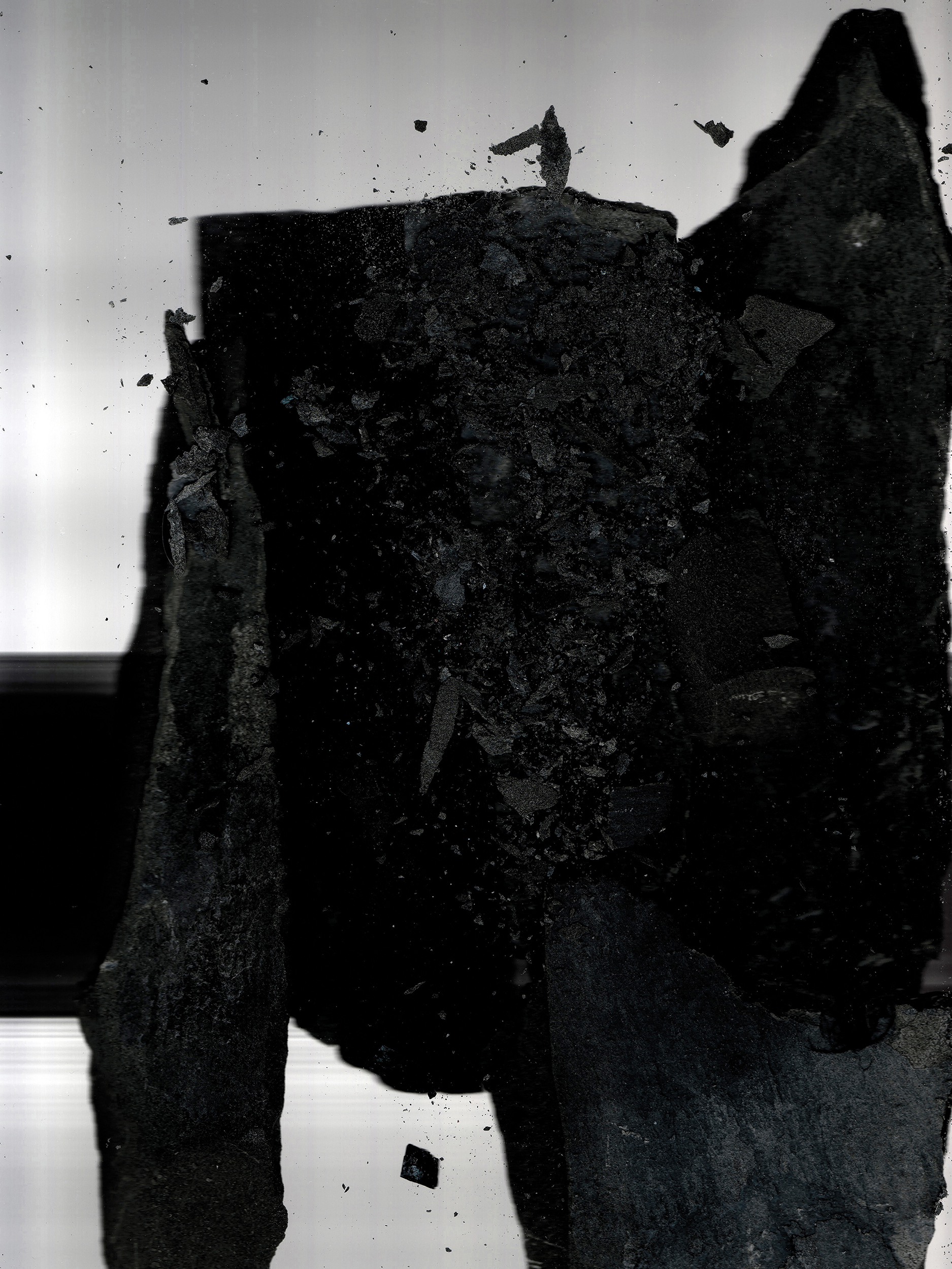 Monochrome Fieldcast work showing a dark fragmented form against a pale ground