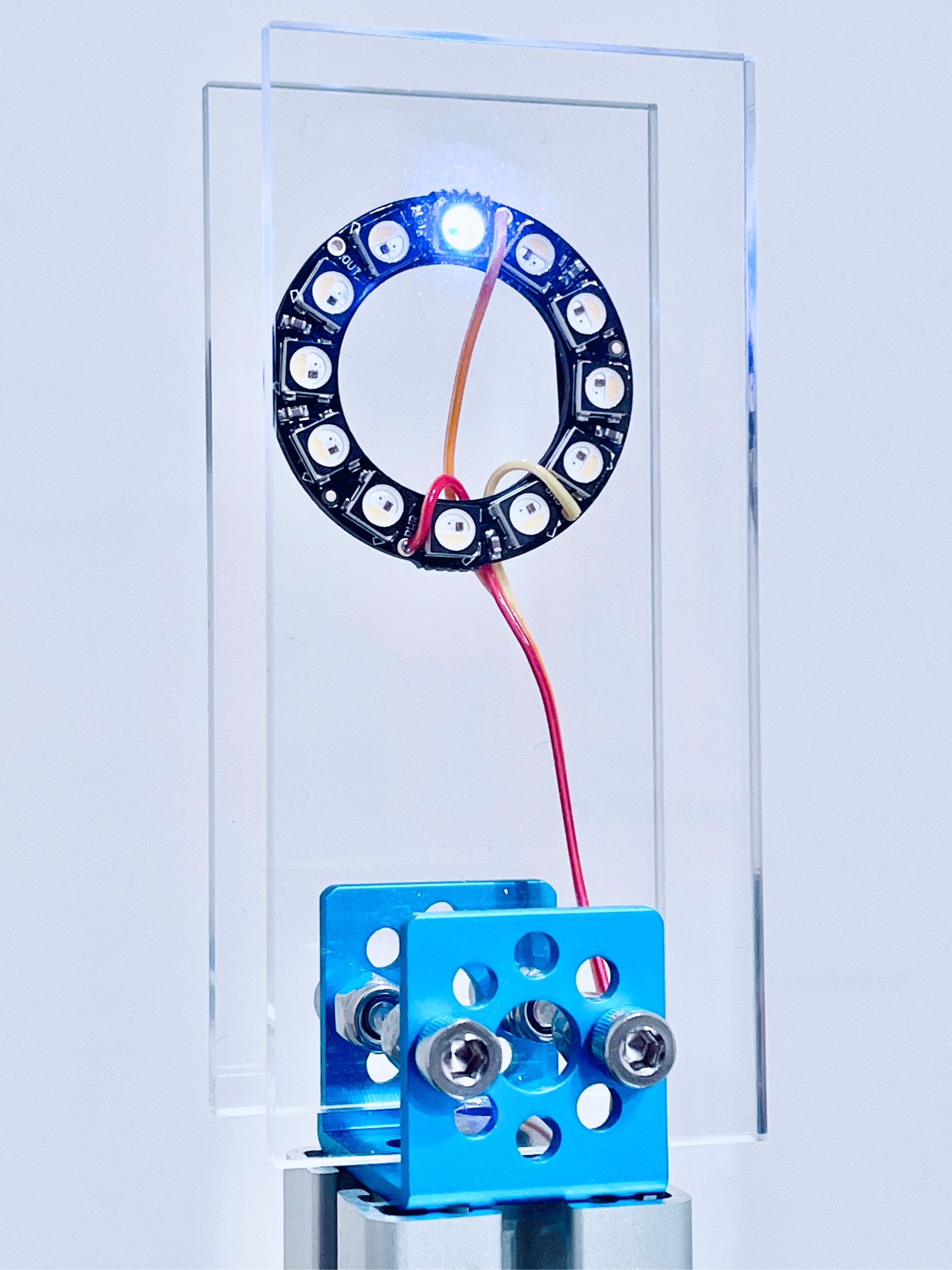 Close view of the circular LED sensor illuminated during a particle event