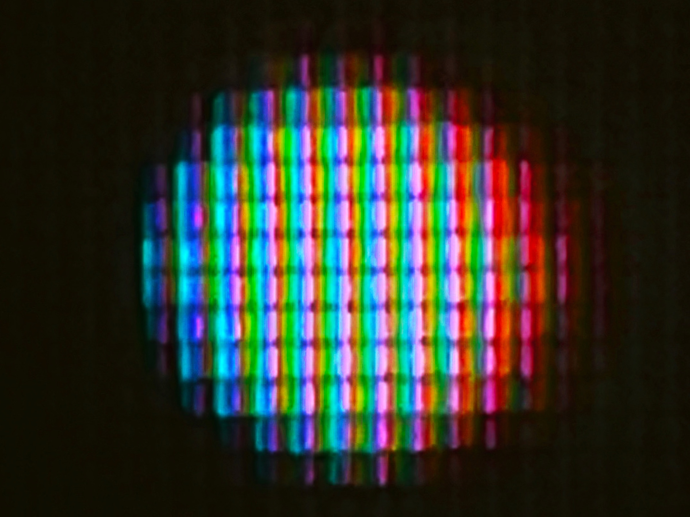 Abstract bands of coloured light produced by the μMuography process