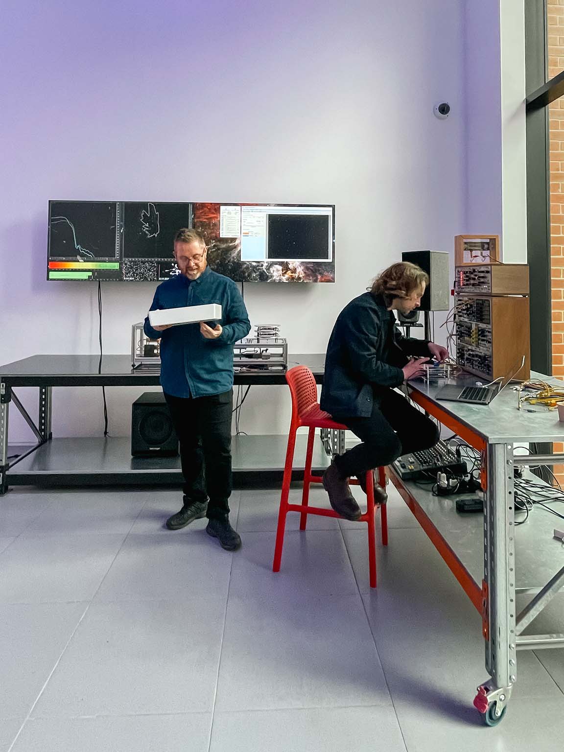 Jon Butt and Lewis Gittus working together in the Muon Sound Lab